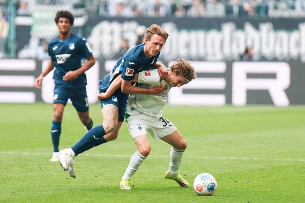 MOENCHENGLADBACH, GERMANY- MAY 16: Wouter Burger (TSG Hoffenheim, 18)challenges Hugo Bolin (Borussia Moenchengladbach, 38)for the ball during the Bundesliga match between Borussia Moenchengladbach vs. TSG 1899 Hoffenheim at Borussia-Park on matchday 34 of the 1. Bundesliga on May 16, 2026 in Moenchengladbach, Germany. DFL REGULATIONS PROHIBIT ANY USE OF PHOTOGRAPHS AS IMAGE SEQUENCES AND OR QUASI-VIDEO. Copyright: xNatachaxFreisenx