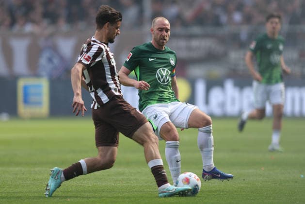 Soccer 1 Bundesliga 34 Matchday FC St Pauli VfL Wolfsburg on 16 05 2026 at Millerntor Stadion in Hamburg Adam Dzwigala St Pauli , front Christian Eriksen Wolfsburg , back DFL regulations prohibit any use of photographs as image sequences and or quasi video xJRx