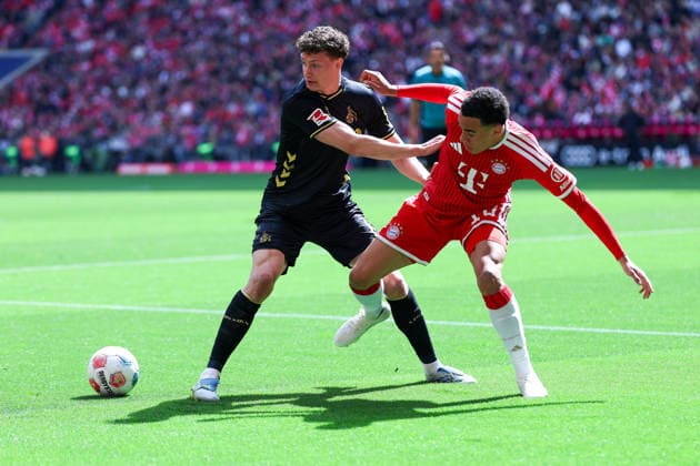 GER 1 FBL, FC Bayern München vs 1 FC Köln 16 05 2026, Allianz Arena, Munich, GER 1 FBL, FC Bayern München vs 1 FC Köln, picture shows Eric Martel 1 FC Köln 6 , left Jamal Musiala FC Bayern München 10 , right nordphotoxGmbHx xSchneider nph00003