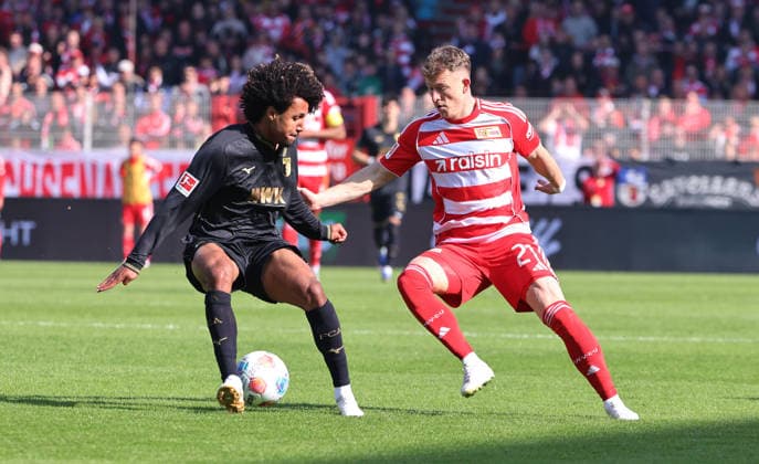 Han Noah Massengo, Tim Skarke on the ball duel Match scene Action Sport Football Soccer Bundesliga Men DFL 34 Matchday Season 2025 2026 16 05 2026 1 FC Union Berlin FCU vs FC Augsburg FCA DFL regulations prohibit any use of photographs as image sequences and or quasi video