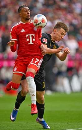 16 05 2026, Soccer Bundesliga 2025 2026, Matchday 34, FC Bayern Munich 1 FC Cologne, at the Allianz Arena Munich, v l Michael Olise FC Bayern Munich vs Kristoffer Lund 1 FC Cologne DFL and DFB regulations prohibit any use of photographs as image sequences and or quasi video