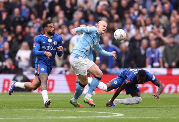 London, England, 16th May 2026. Erling Haaland of Manchester City (c) tussles with Reece James of Chelsea (l) and Malo Gusto of Chelsea (r) during the Chelsea vs Manchester City FA Cup Final match at Wembley Stadium, London. Picture credit should read: David Klein Sportimage EDITORIAL USE ONLY. No use with unauthorised audio, video, data, fixture lists, club league logos or live services. Online in-match use limited to 120 images, no video emulation. No use in betting, games or single club league player publications. SPI_065_DK_Chelsea_Manchester_City SPI-4803-0066
