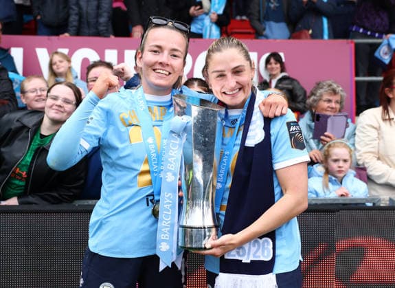 London, , 16th May 2026. Lauren Hemp of Manchester City Women and Laura Coombs of Manchester City Women celebrate with the WSL trophy after the West Ham United Women vs Manchester City Women Barclays Women s Super League match at Chigwell Construction Stadium, London. Picture credit should read: Paul Terry Sportimage EDITORIAL USE ONLY. No use with unauthorised audio, video, data, fixture lists, club league logos or live services. Online in-match use limited to 120 images, no video emulation. No use in betting, games or single club league player publications. SPI_048_PT_West_Ham_W_Man_City_W SPI-4804-0048