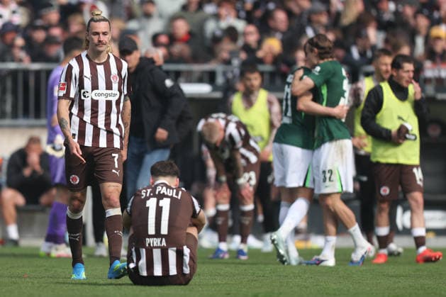 Soccer 1 Bundesliga 34 Matchday FC St Pauli VfL Wolfsburg on 16 05 2026 at Millerntor Stadion in Hamburg Arkadiusz Pyrka St Pauli , front Jackson Irvine St Pauli , back disappointed after relegation DFL regulations prohibit any use of photographs as image sequences and or quasi video xJRx