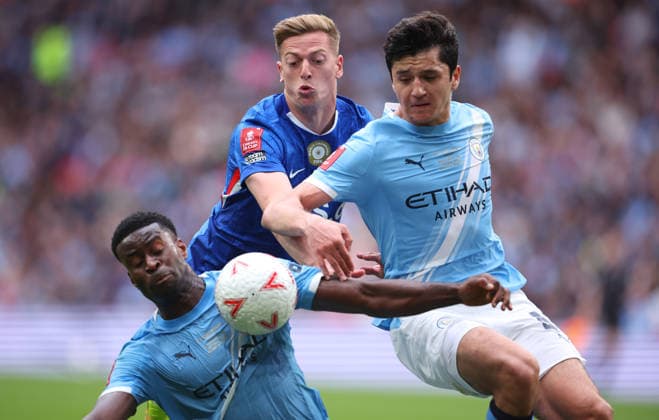 Chelsea v Manchester City - Emirates FA Cup Final Marc Guehi of Manchester City, Liam Delap of Chelsea and Abdukodir Khusanov of Manchester City challenge during the Emirates FA Cup Final match between Chelsea and Manchester City on May 16, 2026 in London, England. WARNING! This Photograph May Only Be Used For Newspaper And Or Magazine Editorial Purposes. May Not Be Used For Publications Involving 1 player, 1 Club Or 1 Competition Without Written Authorisation From Football DataCo Ltd. For Any Queries, Please Contact Football DataCo Ltd on +44 (0) 207 864 9121 London Wembley Stadium England United Kingdom Copyright: xAllstarxPicturexLibraryxLtdx