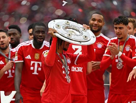 16 05 2026, Soccer Bundesliga 2025 2026, 34 Matchday, FC Bayern Munich 1 FC Cologne, in the Allianz Arena Munich, Michael Olise FC Bayern Munich with the cup DFL and DFB regulations prohibit any use of photographs as image sequences and or quasi video