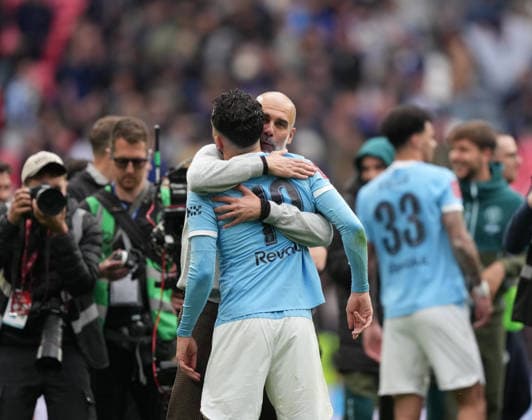 Chelsea v Manchester City FA Cup Final, Football, Wembley Stadium, London, UK - 16 May 2026 Pep Guardiola manager of Manchester City embraces Rayan Cherki of Manchester City after a 1-0 win. London Wembley Stadium London UK, UK NEWSPAPERS OUT Copyright: xSeanxRyanx