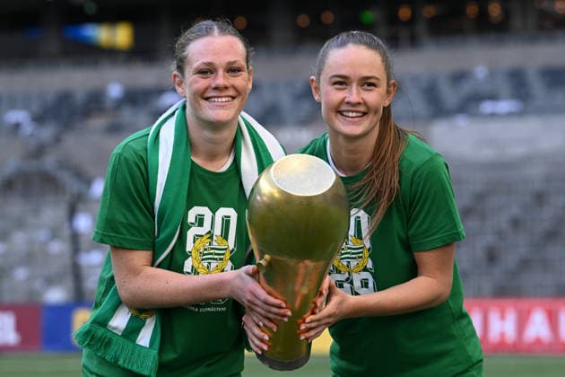 260516 Hammarbys Sofia Reidy and Svea Rehnberg celebrate with the trophy after the final of the Swedish Cup between Hammarby and Häcken on May 16, 2026 in Stockholm  Copyright: EMMAxWALLSKOG BB260516EW116