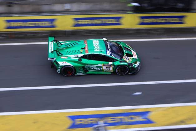 The green Lamborghini with starting number 130 from Red Bull Team ABT drives through the pit lane at the Nürburgring at the ADAC RAVENOL 24h Nürburgring 2026 The car Marco Mapelli Nicholas Yelloly Nicky Catsburg Red Bull Team ABT carries the sponsors Schaeffler, REPXPERT, RAVENOL, H R and Falken and moves through the pit lane with clearly visible motion blur Lamborghini 130 from Red Bull Team ABT in the pit lane Copyright: xspeedshotx