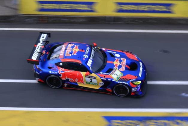 The Mercedes AMG GT3 with the starting number 3 of the Mercedes AMG Team Verstappen Racing drives through the pit lane of the Nürburgring at the ADAC RAVENOL 24h Nürburgring 2026 The vehicle Daniel Juncadella Jules Gounon Lucas Auer Max Verstappen Mercedes AMG Team Verstappen Racing presents itself in the striking blue and red Red Bull design with eye-catching Red Bull sponsor logos, Viaplay and Falken The birds eye view shows the GT3 car at full speed on the asphalt Mercedes AMG GT3 3 from Verstappen Racing at the Nürburgring Copyright: xspeedshotx