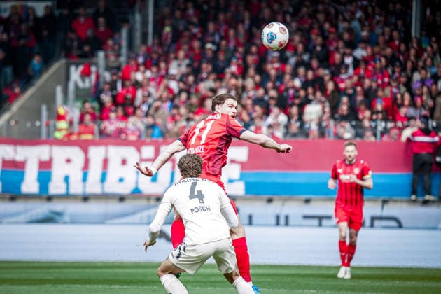 Germany Soccer 1 Bundesliga 2025 2026 , Matchday 34 1 FC Heidenheim vs 1 FSV Mainz 05 Voith Arena Heidenheim an der Brenz Budu Zivzivadze 1 FC Heidenheim, 11 and Stefan Posch Stefan Posch 1 FSV Mainz 05, 4 in header duel, header, duel, on the ball Copyright: xBennetxLongx