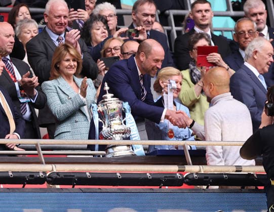 London, England, 16th May 2026. Price William celebrates with Pep Guardiola coach of Manchester City during the Chelsea vs Manchester City FA Cup Final match at Wembley Stadium, London. Picture credit should read: David Klein Sportimage EDITORIAL USE ONLY. No use with unauthorised audio, video, data, fixture lists, club league logos or live services. Online in-match use limited to 120 images, no video emulation. No use in betting, games or single club league player publications. SPI_121_DK_Chelsea_Manchester_City SPI-4803-0126