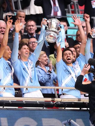 London, England, 16th May 2026. John Stones of Manchester City and Bernardo Silva of Manchester City lift the trophy during the Chelsea vs Manchester City FA Cup Final match at Wembley Stadium, London. Picture credit should read: David Klein Sportimage EDITORIAL USE ONLY. No use with unauthorised audio, video, data, fixture lists, club league logos or live services. Online in-match use limited to 120 images, no video emulation. No use in betting, games or single club league player publications. SPI_129_DK_Chelsea_Manchester_City SPI-4803-0130