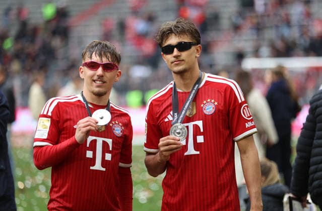 Football, Men, Bundesliga, Season 2025 2026, FC Bayern Munich 1 FC Cologne, Allianz Arena Champion celebration after the match here Lennart Karl FC Bayern Munich left with Tom Bischof FC Bayern Munich right with champion medal and sunglasses, pose DFB, DFL regulations prohibit any use of photographs as image sequences and or quasi video