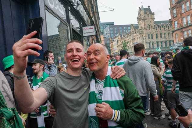 A Celtic fan takes a selfie with Tommy Sheridan is a Alliance to Liberate Scotland candidate as they celebrate their team winning SPL Championship in the Trongate, Glasgow. Celtic Celebrate Winning the William Hill Scottish Premiership, Football, Glasgow, Scotland, UK - 16 May 2026Glasgow Celtic Park United Kingdom  Copyright: xRobertxPerry Shutterstockx 16878623ed