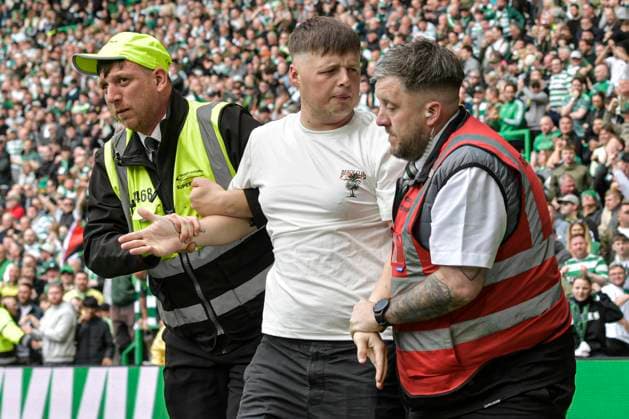 Celtic v Heart of Midlothian William Hill Premiership Fan of Celtic is lead away by stewards during the William Hill Premiership match at Celtic Park, Glasgow 16 05 2026 UK Newspapers OUT Copyright: xJamiexJohnstonx FIL-23440-0231