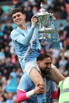 Chelsea v Manchester City. Phil Foden of Manchester City with the trophy at the end of the FA Cup Final Chelsea v Manchester City. Football. The Emirates FA Cup Final. Wembley Stadium, London, UK. 16 MAY 2026Wembley Wembley Stadium LONDON United Kingdom EDITORIAL USE ONLY No use with unauthorised audio, video, data, fixture lists, club league logos or live services. Online in-match use limited to 120 images, no video emulation. No use in betting, games or single club league player publications.  Copyright: xJASONPIX Shutterstockx 16878747cs