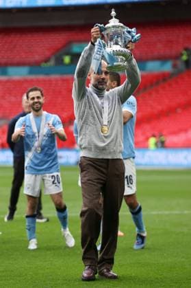 Chelsea v Manchester City. Manchester City Manager Pep Guardiola with the trophy at the end of the FA Cup Final Chelsea v Manchester City. Football. The Emirates FA Cup Final. Wembley Stadium, London, UK. 16 MAY 2026Wembley Wembley Stadium LONDON United Kingdom EDITORIAL USE ONLY No use with unauthorised audio, video, data, fixture lists, club league logos or live services. Online in-match use limited to 120 images, no video emulation. No use in betting, games or single club league player publications.  Copyright: xJASONPIX Shutterstockx 16878747ce