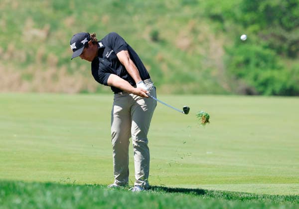 Aldrich Potgieter of South Africa hits out of the rough on the 1st fairway during the third round of the 2026 PGA, Golf Herren Championship at Aronimink Golf Club in Newtown Square, Pennsylvania, on Saturday, May 16, 2026.  PHI20260516835 LAURENCExKESTERSON