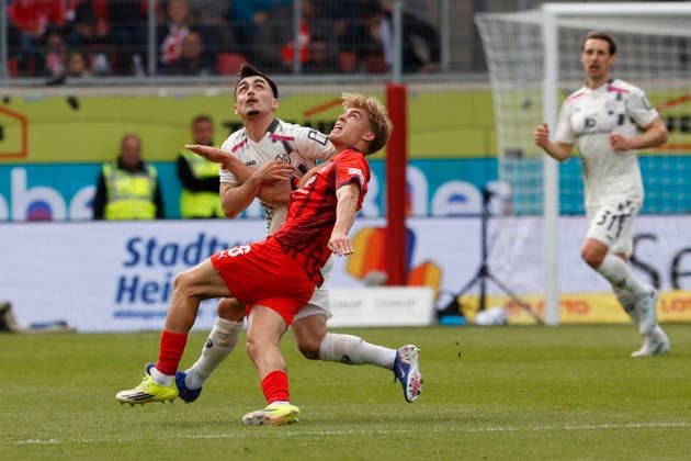 Football, 1 Bundesliga, Matchday 34, 2025 2026, 1 FC Heidenheim vs 1 FSV Mainz 05, 16 05 2026, Voith Arena, Heidenheim, Germany, Paul NEBEL 1 FSV Mainz 05 8 li in duel with Hennes BEHRENS 1 FC Heidenheim 26 Heidenheim Voith Arena Baden Württemberg Germany Copyright: xGaetanoxDixRosax