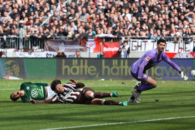 St Pauli vs VfL, 1 BL Hamburg, 16 05 2026, Football, Men, Season 2025 2026, 1 BL, FC St Pauli vs VfL Wolfsburg Adam Daghim VfL Wolfsburg , Tomoya Ando St Pauli Goalkeeper Nikola Vasilij St Pauli DFL DFB REGULATIONS PROHIBIT ANY USE OF PHOTOGRAPHS as IMAGE SEQUENCES and or QUASI VIDEO Millerntor Stadion Germany