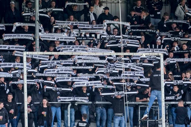 The Ultras of SV Sandhausen wave their fan scarves in the fan curve, home fans, fan block, looking forward to the game, fans, audience, spectators, mood, atmosphere, stadium, 16 05 2026, Sandhausen Germany , Football, Regionalliga Südwest, SV Sandhausen FC 08 Homburg xozx