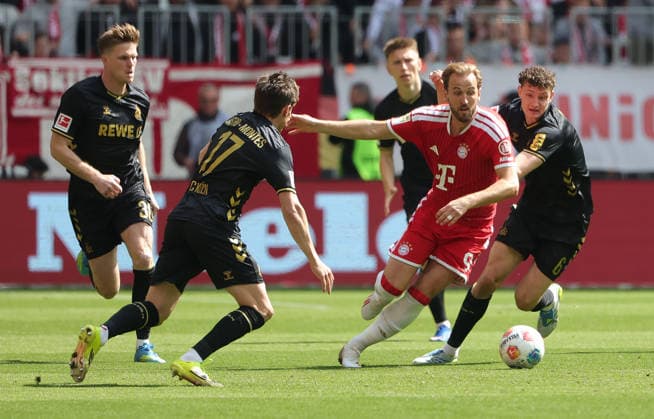 15 05 2026, 1 Bundesliga, Matchday 34, FC Bayern vs 1 FC Koeln, Allianz Arena Muenchen, Soccer, Sports, in the picture Marius Buelter 1 FC Koeln , Alessio Castro Montes 1 FC Koeln , and Harry Kane FC Bayern Muenchen vs Eric Martel 1 FC Koeln