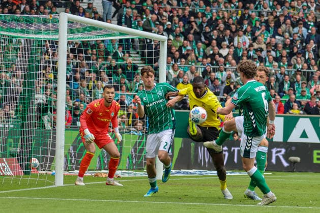 Bremen, Germany 16 May 2026 34 Matchday 1 Bundesliga Werder Bremen vs Borussia Dortmund In the picture from left third Serhou Guirassy BVB tries to score a goal in the Bremen penalty area, behind him goalkeeper Mio Backhaus Werder Bremen and Olivier Deman Werder Bremen and Jens Stage Werder Bremen DFL regulations prohibit any use of photographs as image sequences and or quasi video Copyright: HMBxMedia MadeleinexFantini