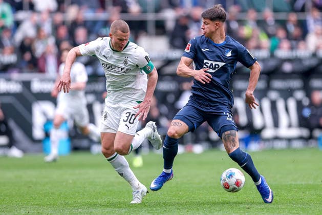 16 05 2026, Football, Borussia Mönchengladbach TSG 1899 Hoffenheim, 1 Soccer Bundesliga, 34 Matchday, Borussia Park, Season 2025 2026 Nico Elvedi Borussia Mönchengladbach 30 in duel against Adam Hlozek TSG Hoffenheim 23 DFB regulations prohibit any use of photographs as image sequences and or quasi video Nordrhein Westfalen Germany