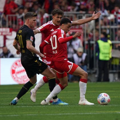 Soccer, 1 BL 2025 2026, FC Bayern München vs 1 FC Köln 16 05 2026 , Allianzarena München Marius Bülter fC Köln, Jamal Musiala FC Bayern München , Hold on to your jersey
