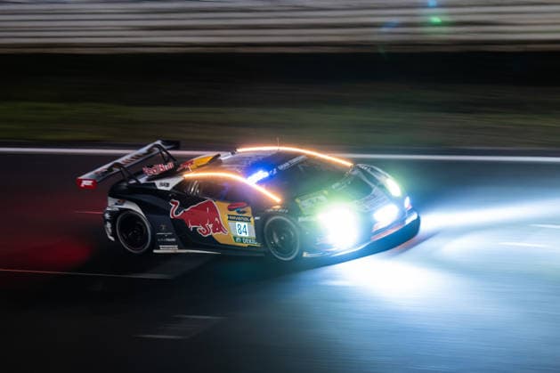 The Lamborghini Huracan GT3 EVO2 with starting number 84 from Team Red Bull Team ABT with drivers Luca Engstler, Mirko Bortolotti and Patric Niederhauser will drive at night on the Nürburgring Grand Prix circuit in Nürburg Rhineland-Palatinate Germany during the 24-hour race.