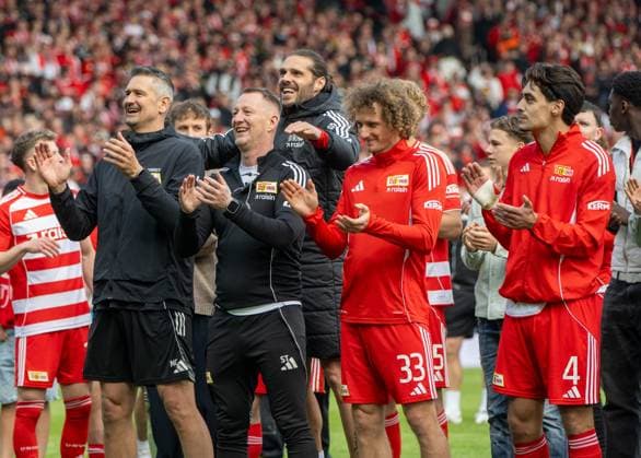 Soccer, Men, Season 2025 2026, 1 Bundesliga 34 Matchday , 1 FC Union Berlin FC Augsburg 4 0 , f l Goalkeeping coach Michael Gspurning 1 FC Union , Physiotherapist Silvio Thieme 1 FC Union , Christopher Trimmel 1 FC Union , Alex Kral 1 FC Union Berlin , Diogo Leite 1 FC Union Berlin , Cheering after the final whistle, 16 05 2026, Copyright: xMatthiasxKochx