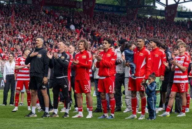 Soccer, Men, Season 2025 2026, 1 Bundesliga 34 Matchday , 1 FC Union Berlin FC Augsburg 4 0 , f l Goalkeeping coach Michael Gspurning 1 FC Union , Physiotherapist Silvio Thieme 1 FC Union , Alex Kral 1 FC Union Berlin , Diogo Leite 1 FC Union Berlin , Danilho Doekhi 1 FC Union , Cheering after the final whistle, 16 05 2026, Copyright: xMatthiasxKochx