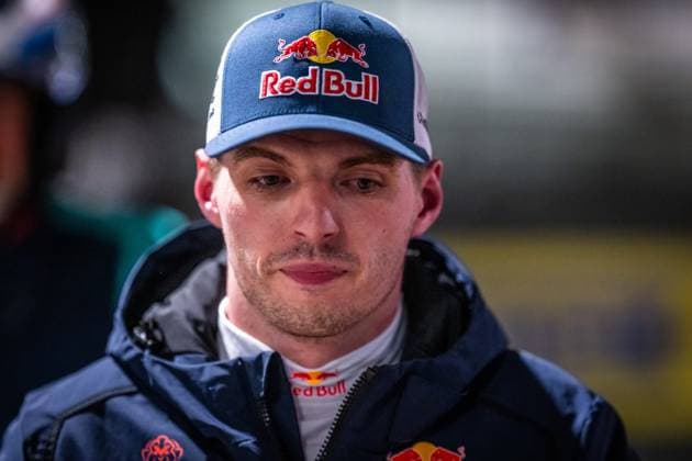 Max Verstappen from Mercedes AMG Team Verstappen Racing can be seen in the paddock of the Nürburgring He is wearing a Red Bull cap and a dark blue jacket with Red Bull branding and looks intently into the camera The blurred paddock ambience can be seen in the background Max Verstappen in the paddock at the 24h Nürburgring 2026 Copyright: xMichaelxGelhardtx
