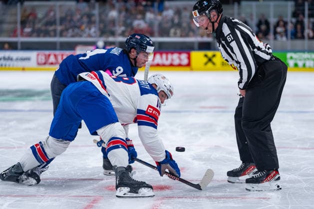 ZURICH, SWITZERLAND - MAY 17: Gustav Jonsson (Linesperson) restarting and Cade Neilson (Great Britain, 94) in the battle for the puck with Sam Lafferty (United States, 18) during the Preliminary Round - Group A Match 11 between Great Britain and United States at the IIHF Ice hockey, Eishockey World Championship, WM, Weltmeisterschaft 2026, Swiss Life Arena on May 17, 2026 in Zurich, Switzerland. Zurich Switzerland Copyright: xTimoxSteinx