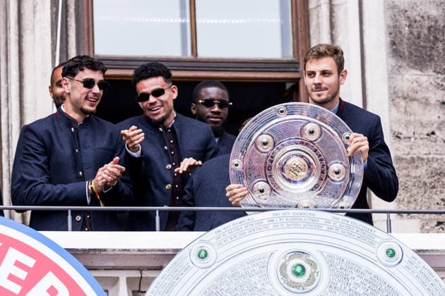 MUNICH, GERMANY - MAY 17: Josip Stanisic (FC Bayern Muenchen, 44) with the trophy on the balcony during the Meisterfeier of FC Bayern Muenchen at Marienplatz on May 17, 2026 in Munich, Germany. Bavaria Germany Copyright: xSteffiexWunderlx