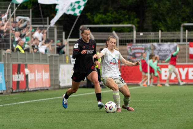 LEVERKUSEN, GERMANY - MAY 17: Carlotta Wamser (37 Bayer 04 Leverkusen) and Chiara Hahn (15 SV Werder Bremen) in action during the Google Pixel Frauen-Bundesliga match between Bayer 04 Leverkusen and SV Werder Bremen at Ulrich-Haberland-Stadion on May 17, 2026 in Leverkusen, Germany. (Photo by Qianru Zhang Press Photo) Copyright: xQianruxZhang SPPx Sportspressphoto_SPR148579