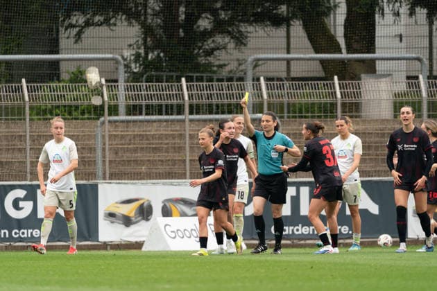 LEVERKUSEN, GERMANY - MAY 17: Kristin Kögel (11 Bayer 04 Leverkusen) get yellow card during the Google Pixel Frauen-Bundesliga match between Bayer 04 Leverkusen and SV Werder Bremen at Ulrich-Haberland-Stadion on May 17, 2026 in Leverkusen, Germany. (Photo by Qianru Zhang Press Photo) Copyright: xQianruxZhang SPPx Sportspressphoto_SPR148592