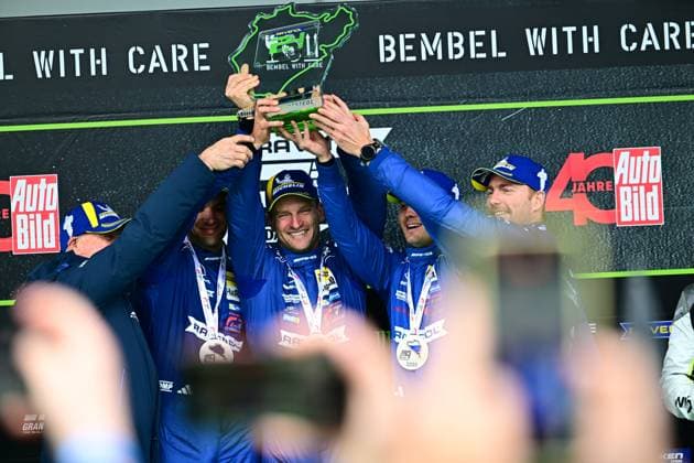 The Mercedes AMG GT3 of RAVENOL Motorsport with Luca Stolz, Maro Engel and Maxime Martin triumphs at the ADAC RAVENOL 24h Nürburgring 2026 The team raises the green and black trophy at the podium, while the drivers in their blue team overalls radiate their joy about the endurance success Mercedes AMG 80 of RAVENOL Motorsport wins the 24h Nürburgring 2026 Copyright: xMichaelxGelhardtx