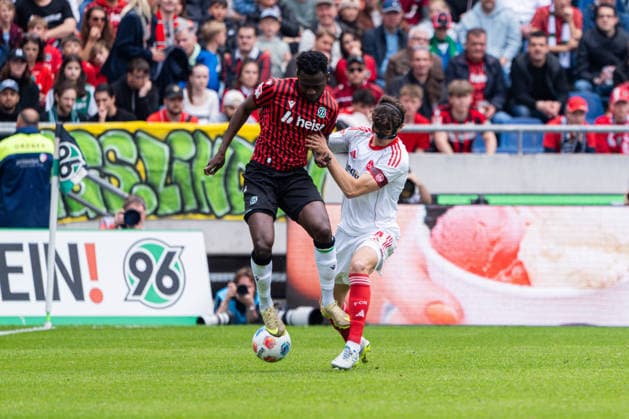 Hannover, Germany 17 May 2026 2 BL 2025 2026 Sp 34 Hannover 96 v 1 FC Nürnberg Pictured from left in a duel Mustapha Bundu HAN and Fabio Gruber FCN DFL DFB regulations prohibit any use of photographs as image sequences and or quasi video Heinz von Heiden Arena Niedersachsen Copyright: xFotostandx xKruczynskix