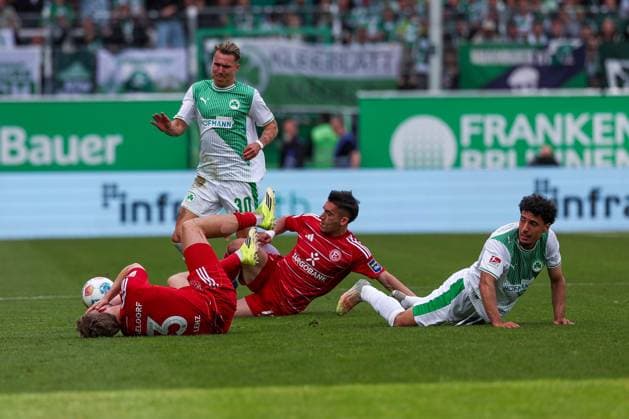 Yellow card for Sotiris Alexandropoulos 14 Fortuna Duesseldorf after this foul on Felix Klaus 30 Spvgg Greuther Fuerth , action, with Christopher Lenz 3 Fortuna Duesseldorf and Sayallah Ltaief Spvgg Greuther Fuerth , SpVgg Greuther Fuerth vs Fortuna Duesseldorf, Football, Men, 2 Bundesliga, DFL, Season 2025 2026, 34 Matchday, Second round, 17 05 2026 DFB regulations prohibit any use of photographs as image sequences and or quasi video Fuerth Bayern Germany Copyright: xkolbert-press MartinxAgüerax