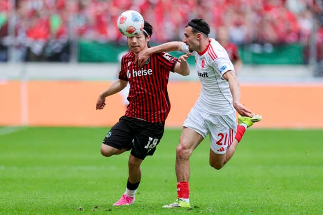 Daisuke Yokota Hannover 96 and Berkay Yilmaz 1 FC Nuernberg battle for the ball, 2 Bundesliga, Hannover 96 v 1 FC Nuernberg, Heinz von Heiden Arena on May 17, 2026 in Hanover, Germany Photo by Marco Steinbrenner DeFodi Images Daisuke Yokota Hannover 96 and Berkay Yilmaz 1 FC Nuernberg battle for the ball, 2 Bundesliga, Hannover 96 v 1 FC Nuernberg, Heinz von Heiden Arena, May 17, 2026 in Hanover, Germany Photo by Marco Steinbrenner DeFodi Images