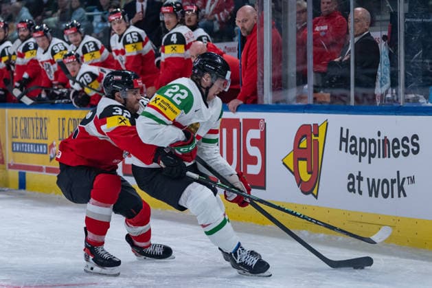 ZURICH, SWITZERLAND - MAY 17: Bernd Wolf (Austria, 32) in the battle for the puck with Vilmos Gallo (Hungary, 22) during the Preliminary Round - Group A Match 13 between Austria and Hungary at the IIHF Ice hockey, Eishockey World Championship, WM, Weltmeisterschaft 2026, Swiss Life Arena on May 17, 2026 in Zurich, Switzerland. Zurich Switzerland Copyright: xTimoxSteinx