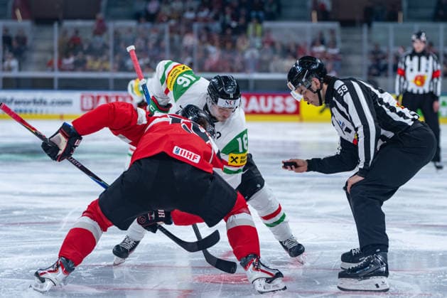 ZURICH, SWITZERLAND - MAY 17: Janos Hari (Hungary, 16) in a duel against Vinzenz Rohrer (Austria, 19) started by Mitchell Gibbs (Linesperson) during the Preliminary Round - Group A Match 13 between Austria and Hungary at the IIHF Ice hockey, Eishockey World Championship, WM, Weltmeisterschaft 2026, Swiss Life Arena on May 17, 2026 in Zurich, Switzerland. Zurich Switzerland Copyright: xTimoxSteinx