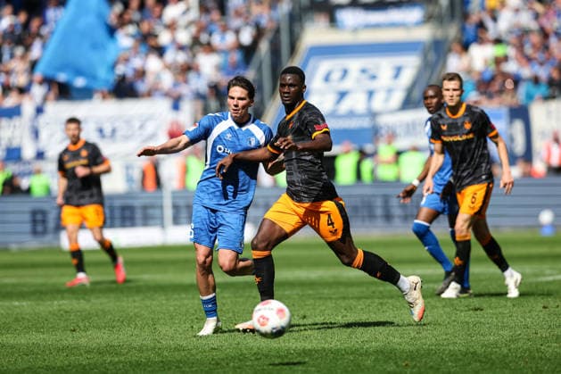 Maxwell Gyamfi 1 FC Kaiserslautern,4 vs Dariusz Stalmach 1 FC Magdeburg,6 2 Soccer Bundesliga Season 2025 2026 1 FC Magdeburg vs 1 FC Kaiserslautern at the Avnet Arena in Magdeburg Action,Soccer,Man,Men,Germany,17 05 2026
