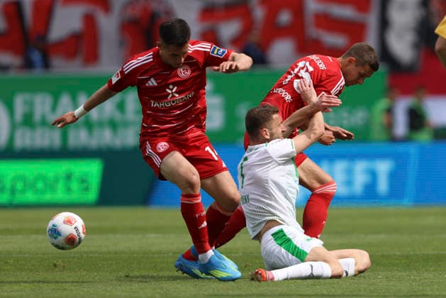 Sotiris Alexandropoulos Fortuna Düsseldorf , Dennis Srbeny SpVgg Greuther Fürth and Tim Oberdorf Fortuna Düsseldorf in a duel during the 2 Bundesliga match between SpVgg Greuther Fürth and Fortuna Düsseldorf, Sportpark Ronhof Thomas Sommer on 17 May 2026 in Fürth, Germany Photo by Oliver Kaelke DeFodi Images Sotiris Alexandropoulos Fortuna Düsseldorf , Dennis Srbeny SpVgg Greuther Fürth and Tim Oberdorf Fortuna Düsseldorf battle for the ball during the 2 Bundesliga match between SpVgg Greuther Fürth and Fortuna Düsseldorf at Sportpark Ronhof Thomas Sommer on May 17, 2026 in Fürth, Germany Photo by Oliver Kaelke DeFodi Images Photo by Oliver Kaelke DeFodi Images