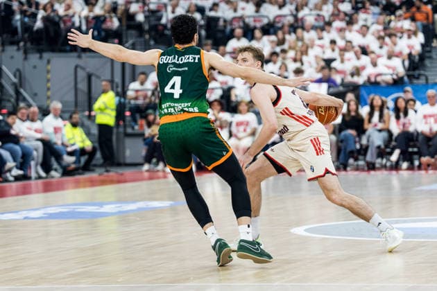 MUNICH, GERMANY - MAY 17: Justus Hollatz (FC Bayern Muenchen, 21) controls the ball against Clay Guillozet (Vet-Concept Gladiators Trier, 4) during the easyCredit Basketball Bundesliga Playoffs Quarterfinal Game 1 between FC Bayern Muenchen vs. Vet-Concept Gladiators Trier at SAP Garden on match 1 of the Playoffs Quarterfinals Best of Five of easyCredit Basketball Bundesliga on May 17, 2026 in Munich, Germany. Bavaria Germany Copyright: xSteffiexWunderlx