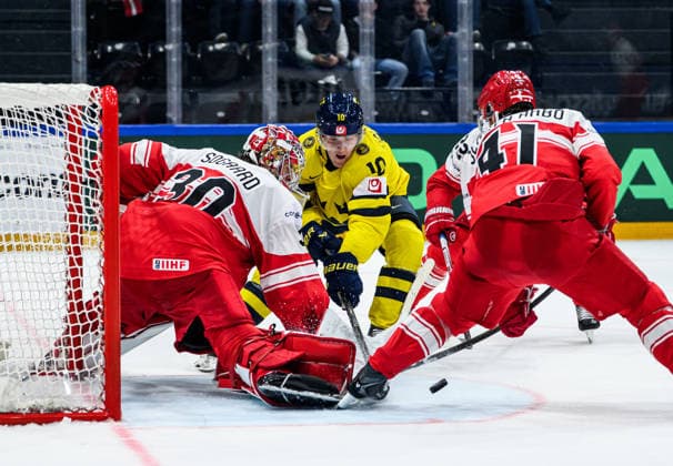 260517 Goaltender Mads Sogaard and Jesper Jensen Aabo of Denmark compete for the puck with Simon Holmström of Sweden during the 2026 IIHF Ice Hockey World Championship match between Denmark and Sweden on May 17, 2026 in Fribourg Photo Jesper Zerman BILDBYRAN kod JZ JZ0716 ishockey ice hockey ishockey vm 2026 vm 2026 iihf world championship denmark sverige sweden bbeng  Copyright: JESPERxZERMAN BB260517JZ059