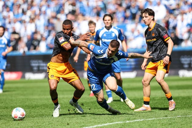 Mateusz Zukowski 1 FC Magdeburg,22 vs Maxwell Gyamfi 1 FC Kaiserslautern,4 2 Soccer Bundesliga Season 2025 2026 1 FC Magdeburg vs 1 FC Kaiserslautern at the Avnet Arena in Magdeburg Action,Soccer,Man,Men,Germany,17 05 2026