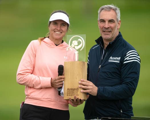 HAMBURG, GERMANY - MAY 17: Leonie Harm of Germany poses with the winning trophy alongside Daniel Reitz, Marketing Officer of Amundi, following her victory during the final round of the Amundi German Masters at Green Eagle Golf Courses on May 17, 2026 in Hamburg, Germany. Credit: Andy Astfalck NurPhoto Germany Copyright: xAndyxAstfalckx